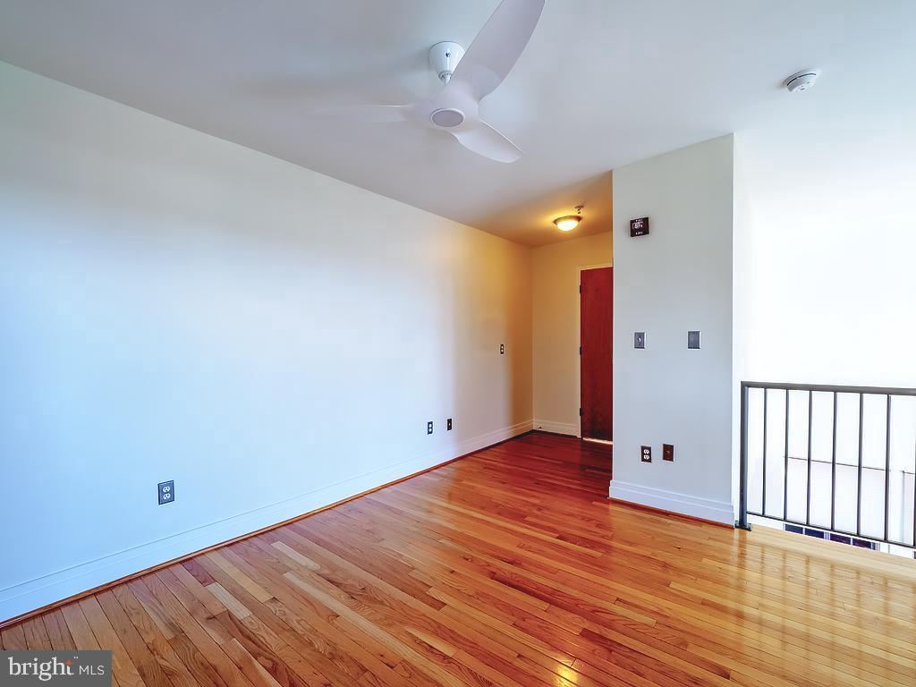 1530 14th Street Northwest, Unit 3B Washington, DC 20005 - Photo 14 of 28 a view of an empty room with wooden floor