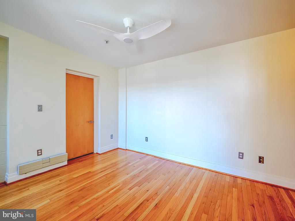 1530 14th Street Northwest, Unit 3B Washington, DC 20005 - Photo 15 of 28 a view of empty room with wooden floor