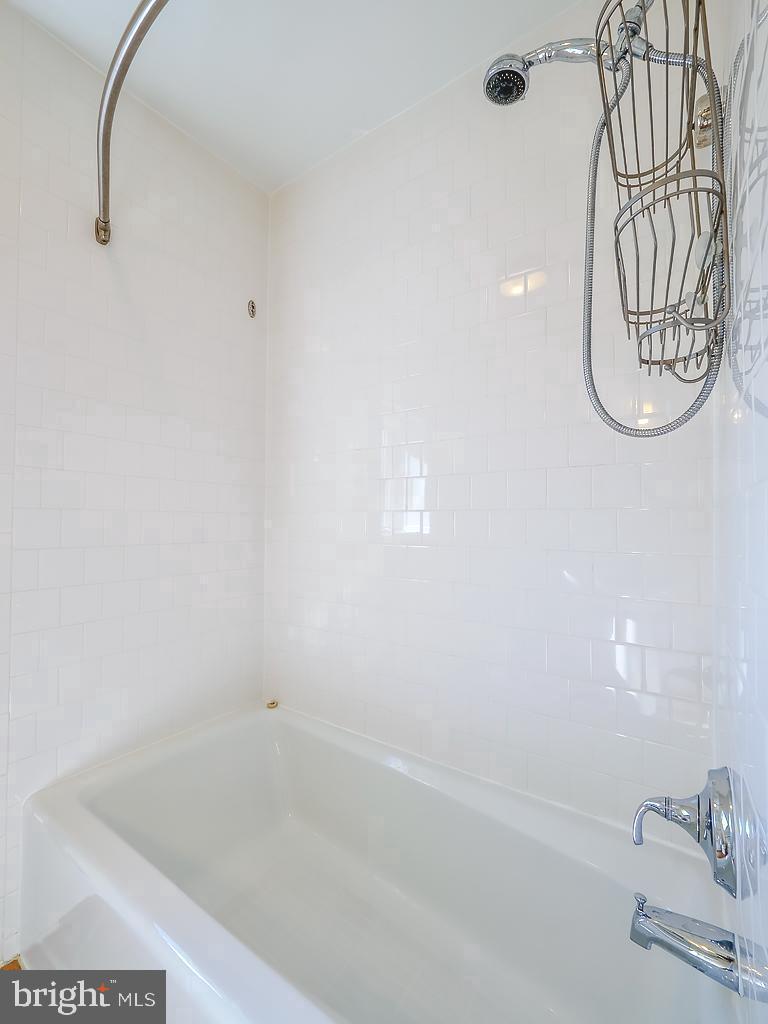 1530 14th Street Northwest, Unit 3B Washington, DC 20005 - Photo 18 of 28 a bathroom with a bathtub and a shower