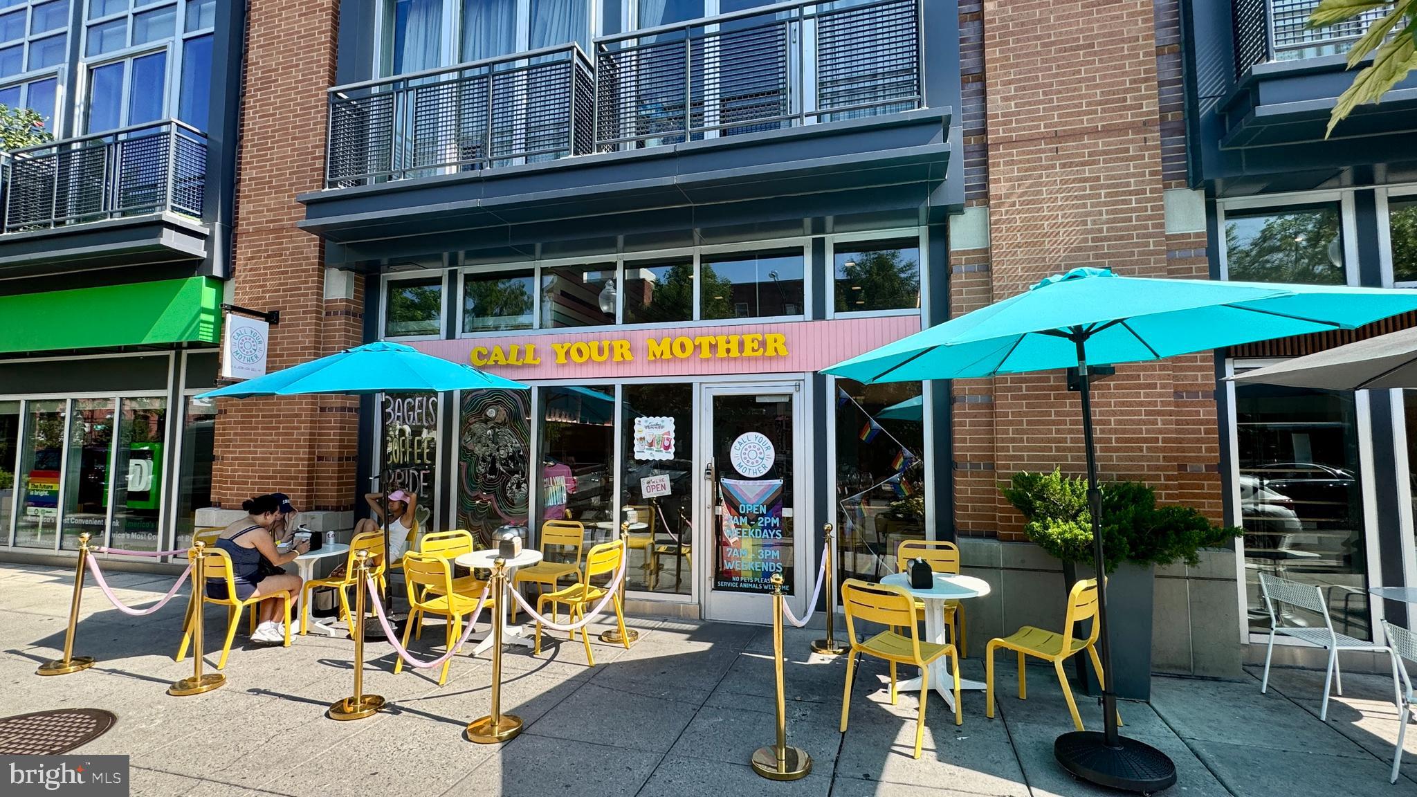 1530 14th Street Northwest, Unit 3B Washington, DC 20005 - Photo 27 of 28 a view of a cafe with a table and chairs under an umbrella
