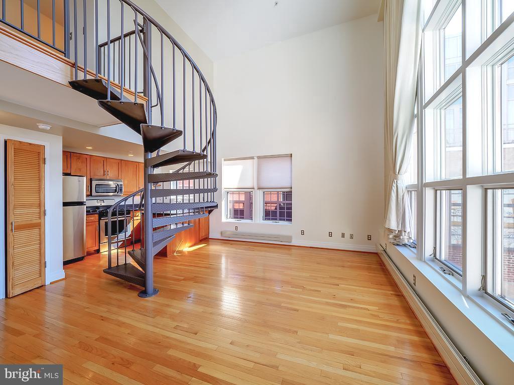 1530 14th Street Northwest, Unit 3B Washington, DC 20005 - Photo 5 of 28 a view of staircase with wooden floor and a large window