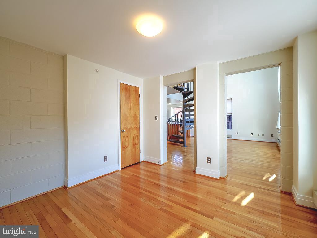 1530 14th Street Northwest, Unit 3B Washington, DC 20005 - Photo 8 of 28 wooden floor in an empty room