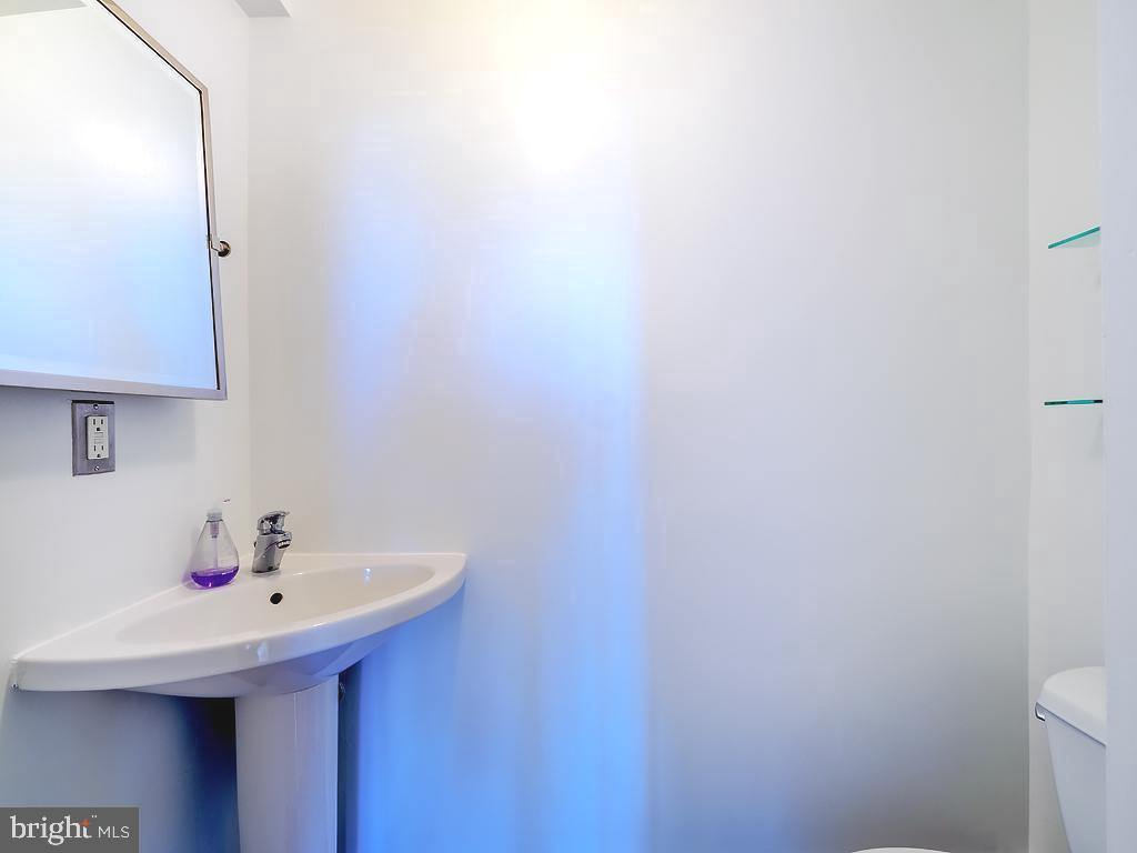 1530 14th Street Northwest, Unit 3B Washington, DC 20005 - Photo 10 of 28 a bathroom with a sink and a toilet