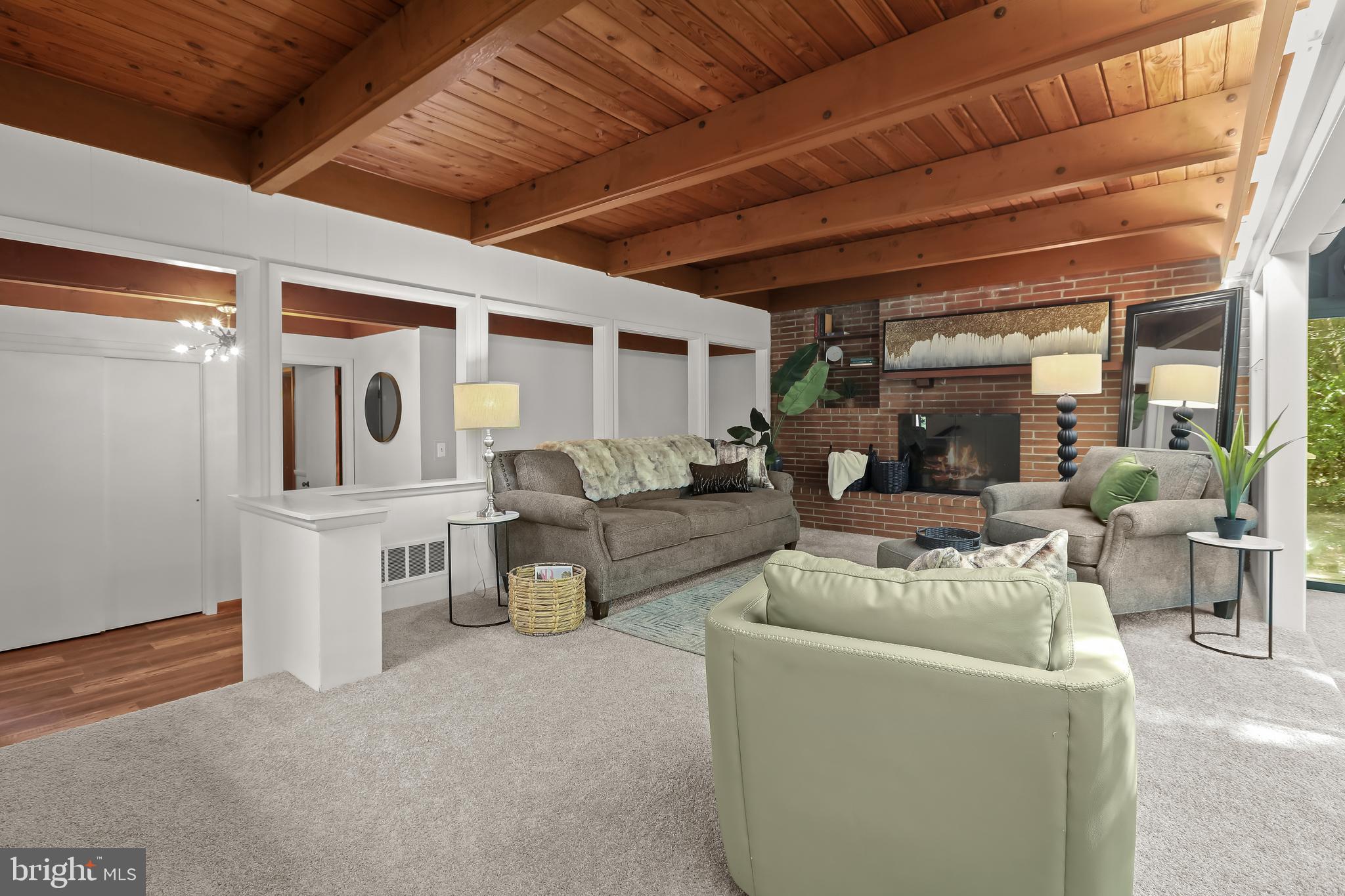 1725 St Giles Road Gibson Island, MD 21056 - Photo 13 of 43 Living Room with Wood Beamed Ceilings Throughout