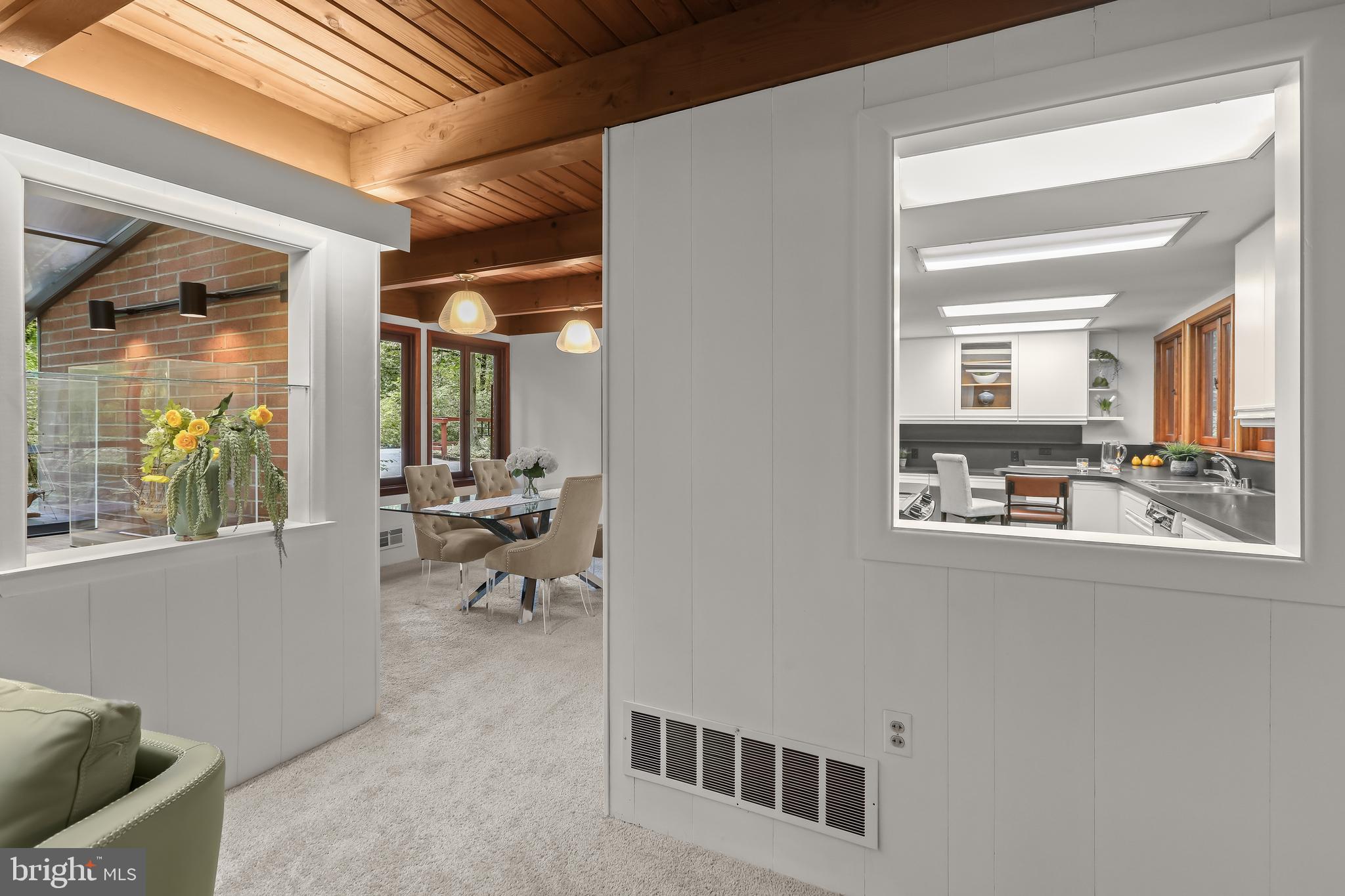 1725 St Giles Road Gibson Island, MD 21056 - Photo 19 of 43 Living Room Opening to Kitchen and Dining Area