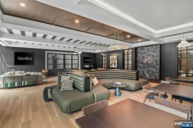 a room with furniture pool table table tennis table soccer and windows