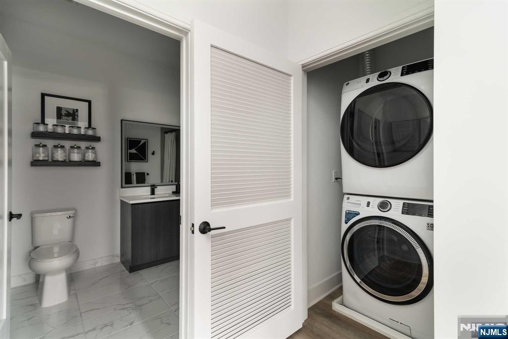 18 Park Avenue, Unit 1218 Old Tappan, NJ 07675 - Photo 28 of 33 a view of a hallway with washer and dryer