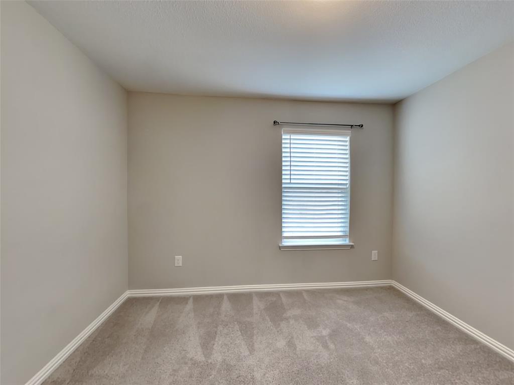 251 Novacek Street Irving, TX 75063 - Photo 11 of 18 an empty room with a window