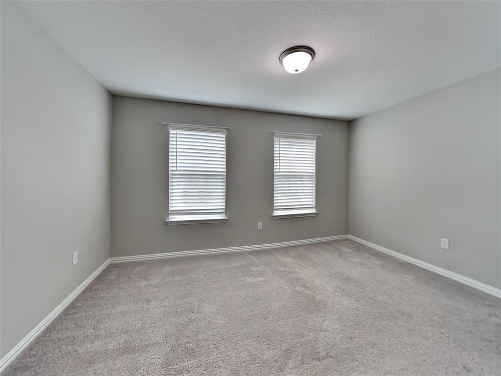 251 Novacek Street Irving, TX 75063 - Photo 13 of 18 a view of an empty room with a window