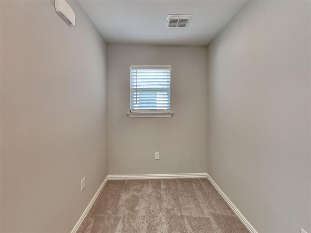 251 Novacek Street Irving, TX 75063 - Photo 17 of 18 an empty room with a window
