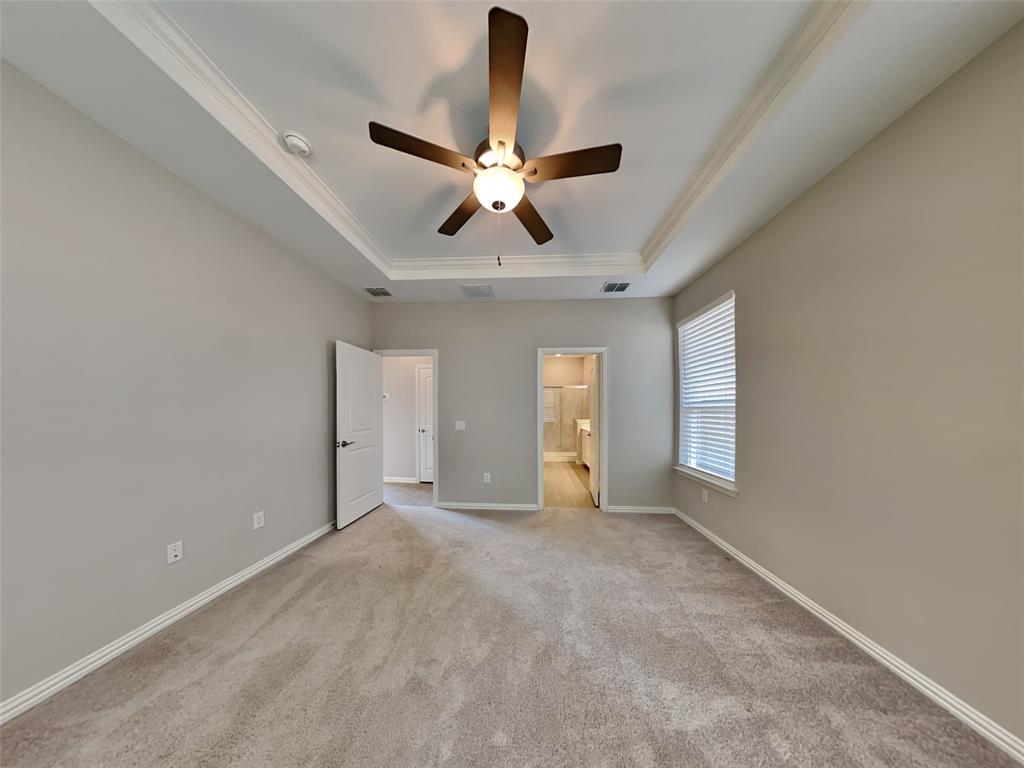 251 Novacek Street Irving, TX 75063 - Photo 8 of 18 a view of an empty room and window with a chandelier fan