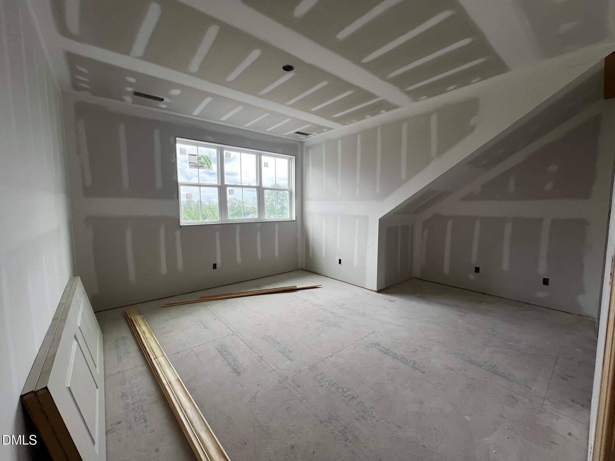 1675 Terry Road Durham, NC 27712 - Photo 12 of 23 a view of an empty room with a window