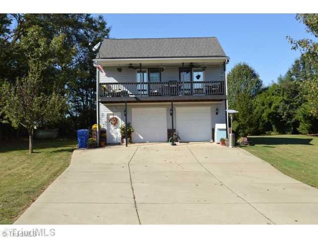 5415 Cook Collier Road Liberty, NC 27298 - Photo 1 of 16 Exterior Front. Front of Home, Relax in your balcony deck patio rocking chair and enjoy lemonade.