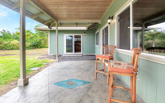 a view of a yard with a tree
