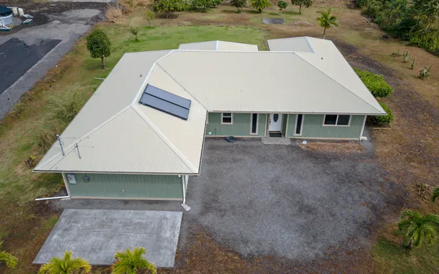 an aerial view of residential houses with outdoor space and street view