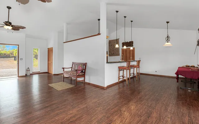 a view of an entryway with wooden floor