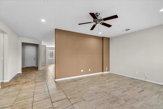 a sign that is sitting in front of a lake with a big yard