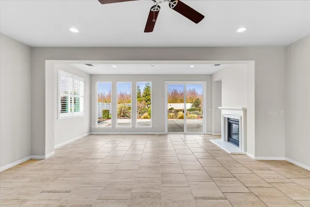 an aerial view of a residential houses with outdoor space and street view