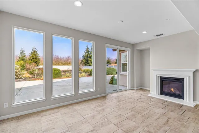 an aerial view of a residential houses with outdoor space