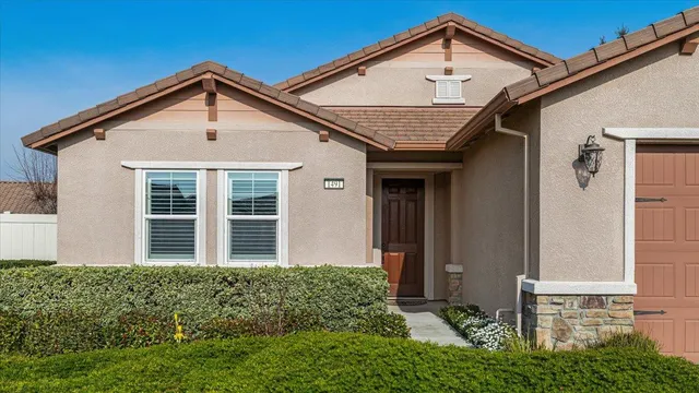a kitchen with granite countertop stainless steel appliances a refrigerator sink and microwave