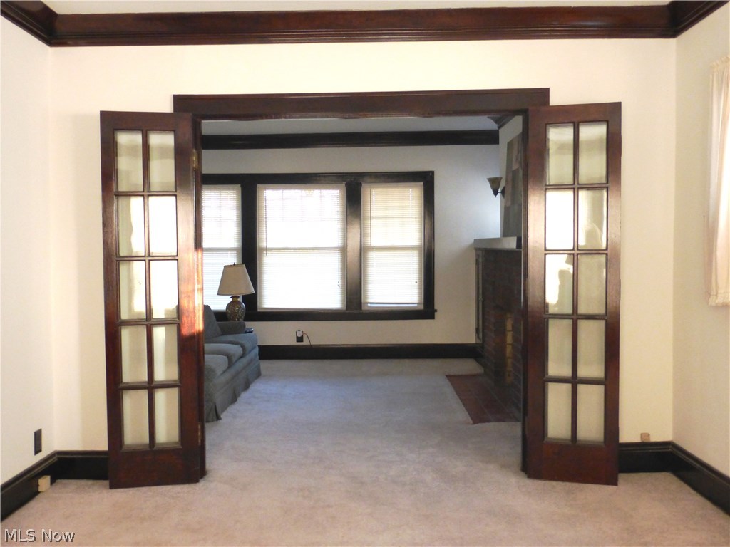 2224 Maplewood Road Cleveland, OH 44118 - Photo 15 of 32 Beautiful French doors can separate the living room from the dining room and add a touch of class opened or closed.