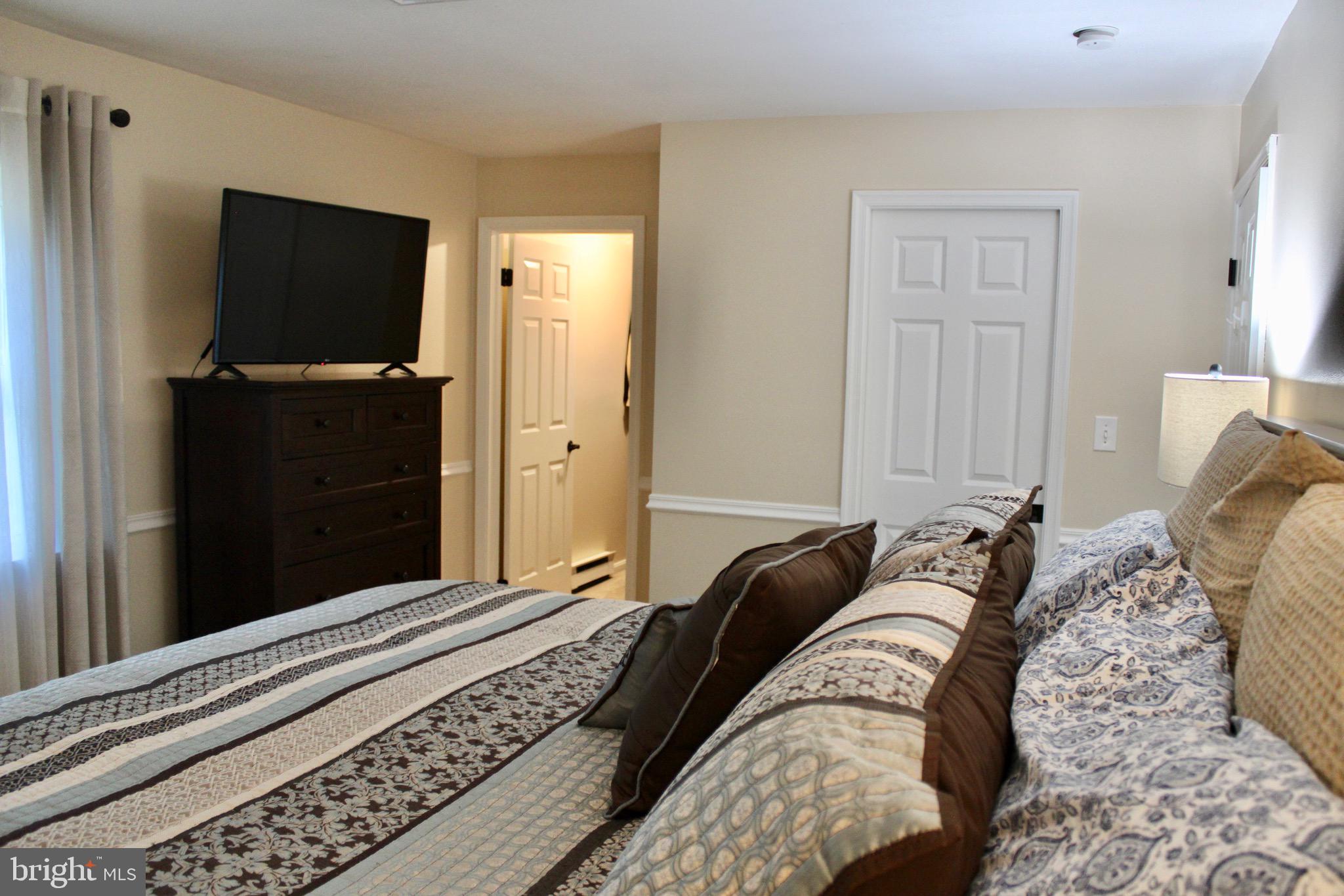 5331 Strasburg Road Kinzers, PA 17535 - Photo 13 of 31 a bed sitting in a bedroom and flat screen tv