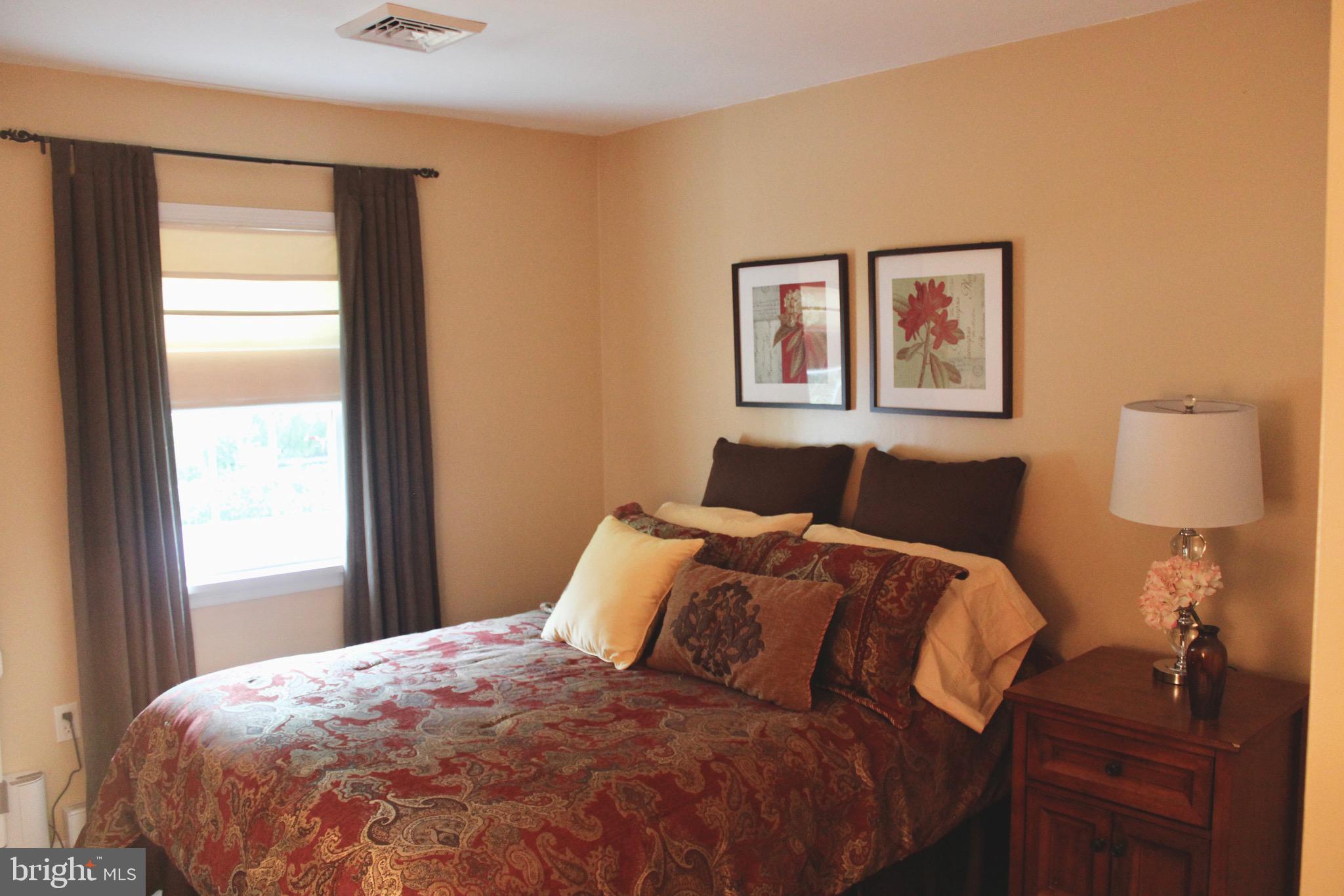 5331 Strasburg Road Kinzers, PA 17535 - Photo 17 of 31 a bed sitting in a bedroom next to a window