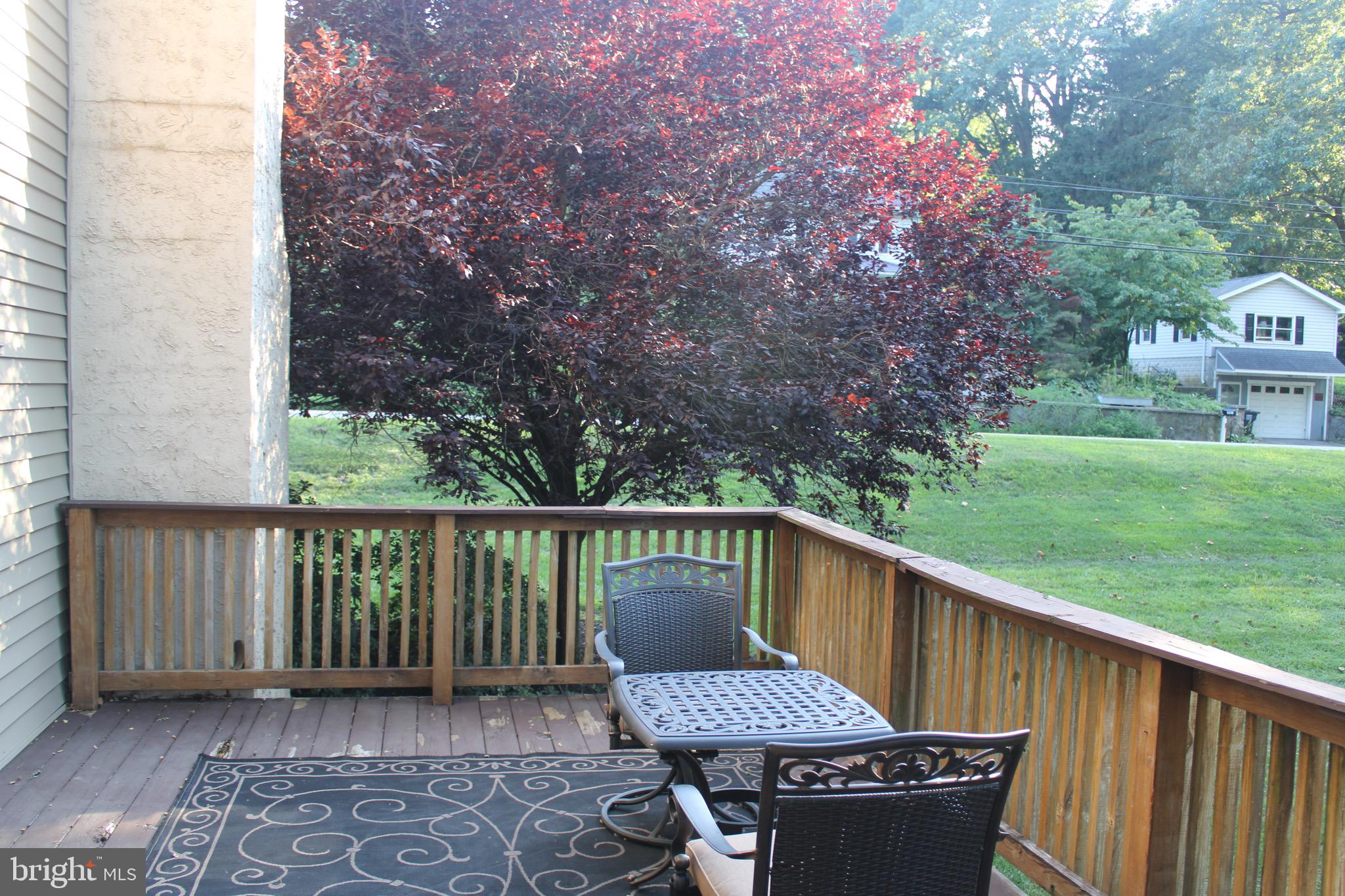 5331 Strasburg Road Kinzers, PA 17535 - Photo 22 of 31 a view of a deck with two chair and a floor to ceiling window