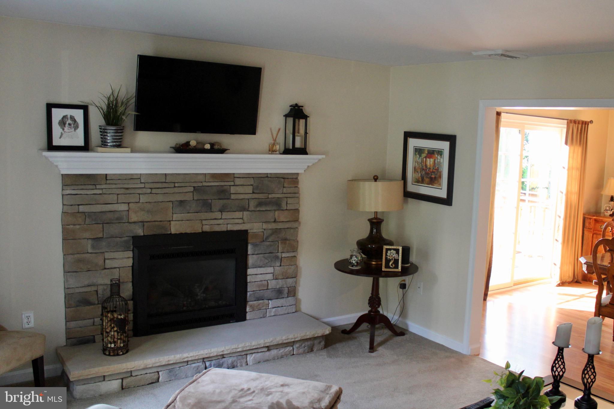 5331 Strasburg Road Kinzers, PA 17535 - Photo 5 of 31 a living room with furniture and a fireplace