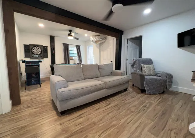 a bedroom with a bed and a refrigerator