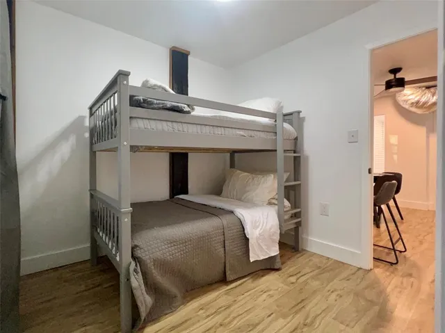 a bathroom with a double vanity sink mirror and toilet
