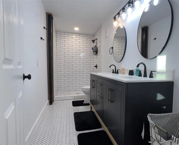 a view of a house with a yard and fire pit