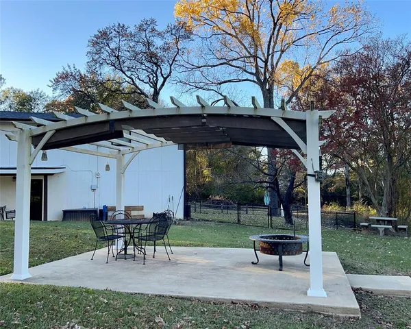 a view of a park with large trees