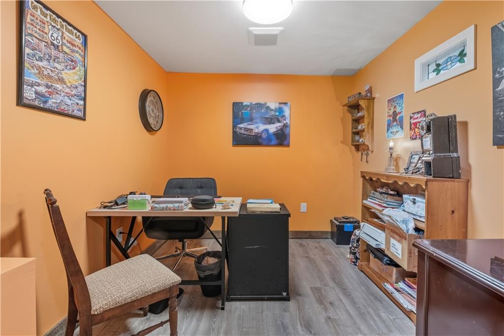565 Raiford Road Cedartown, GA 30125 - Photo 16 of 37 a view of a workspace with furniture and wooden floor