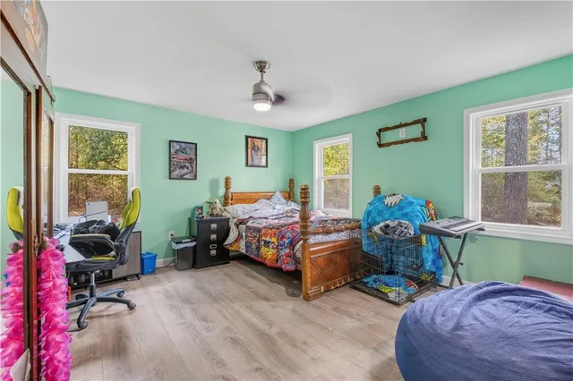 a bed room with furniture and a window