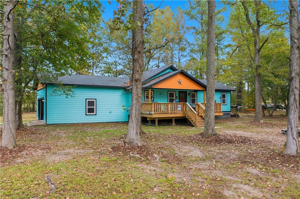 565 Raiford Road Cedartown, GA 30125 - Photo 2 of 37 a backyard of a house with yard barbeque oven and outdoor seating
