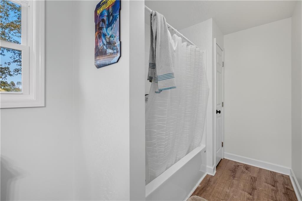 565 Raiford Road Cedartown, GA 30125 - Photo 21 of 37 a bathroom with a bathtub and shower