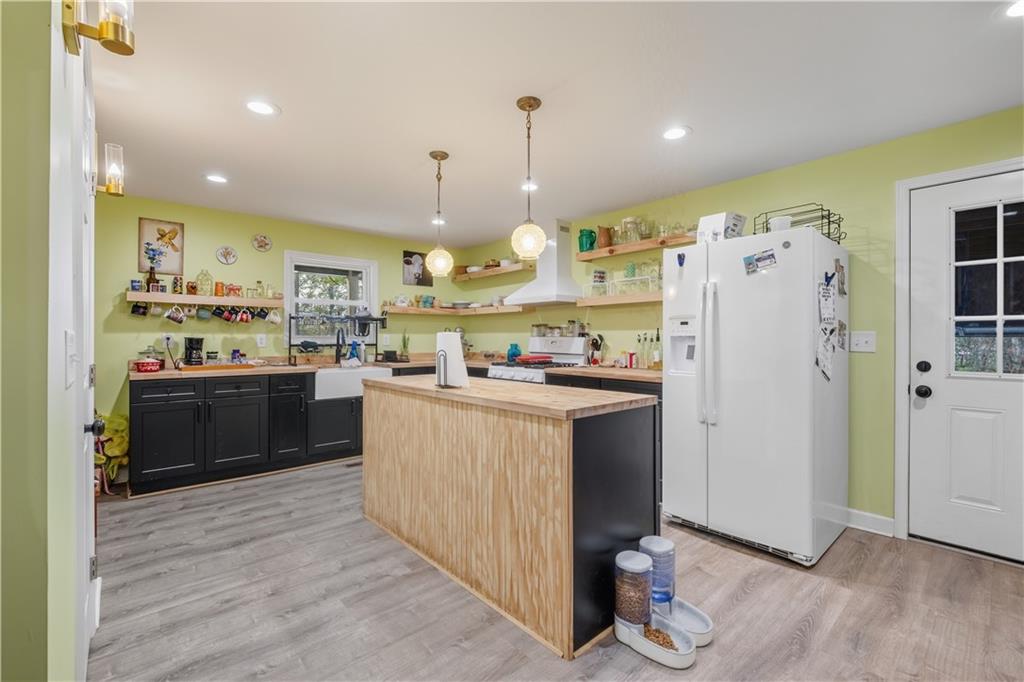 565 Raiford Road Cedartown, GA 30125 - Photo 22 of 37 a kitchen with refrigerator and cabinets