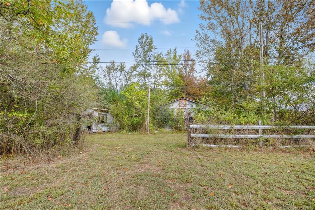 565 Raiford Road Cedartown, GA 30125 - Photo 35 of 37 a backyard of a house with lots of green space and fountain