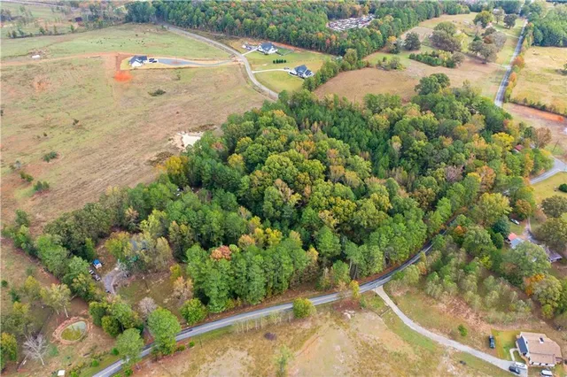 a view of a swimming pool with a yard