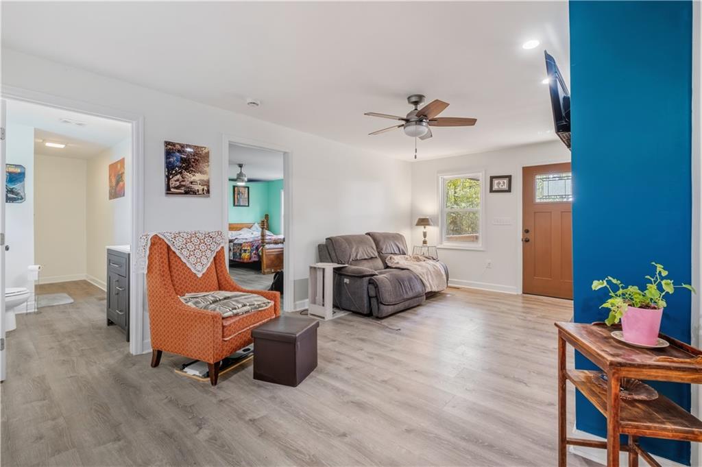 565 Raiford Road Cedartown, GA 30125 - Photo 9 of 37 a living room with furniture and a chandelier