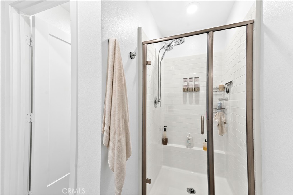 305 Strike Drive Covina, CA 91722 - Photo 12 of 24 a bathroom with a shower and a glass door