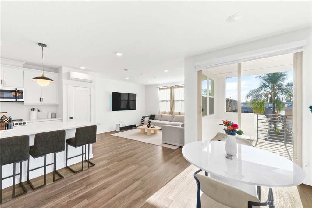 305 Strike Drive Covina, CA 91722 - Photo 5 of 24 a view of a dining room with furniture and wooden floor