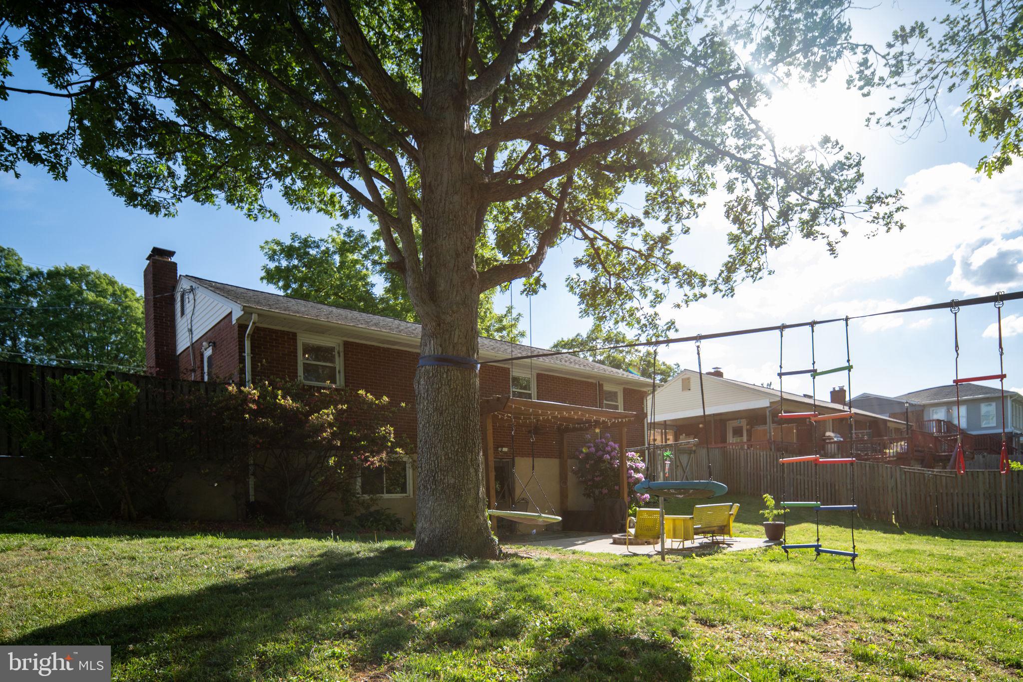 6714 Ruskin Street Springfield, VA 22150 - Photo 54 of 63 a view of a house with backyard and sitting area