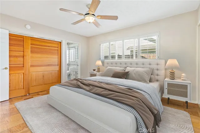 a bedroom with a large bed and a window