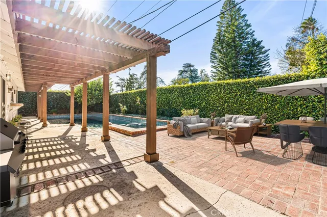 a building outdoor space with patio furniture and garden