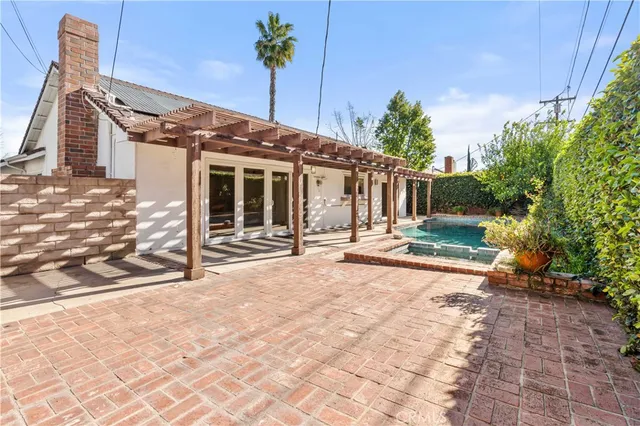 a view of a house with a snow in the yard