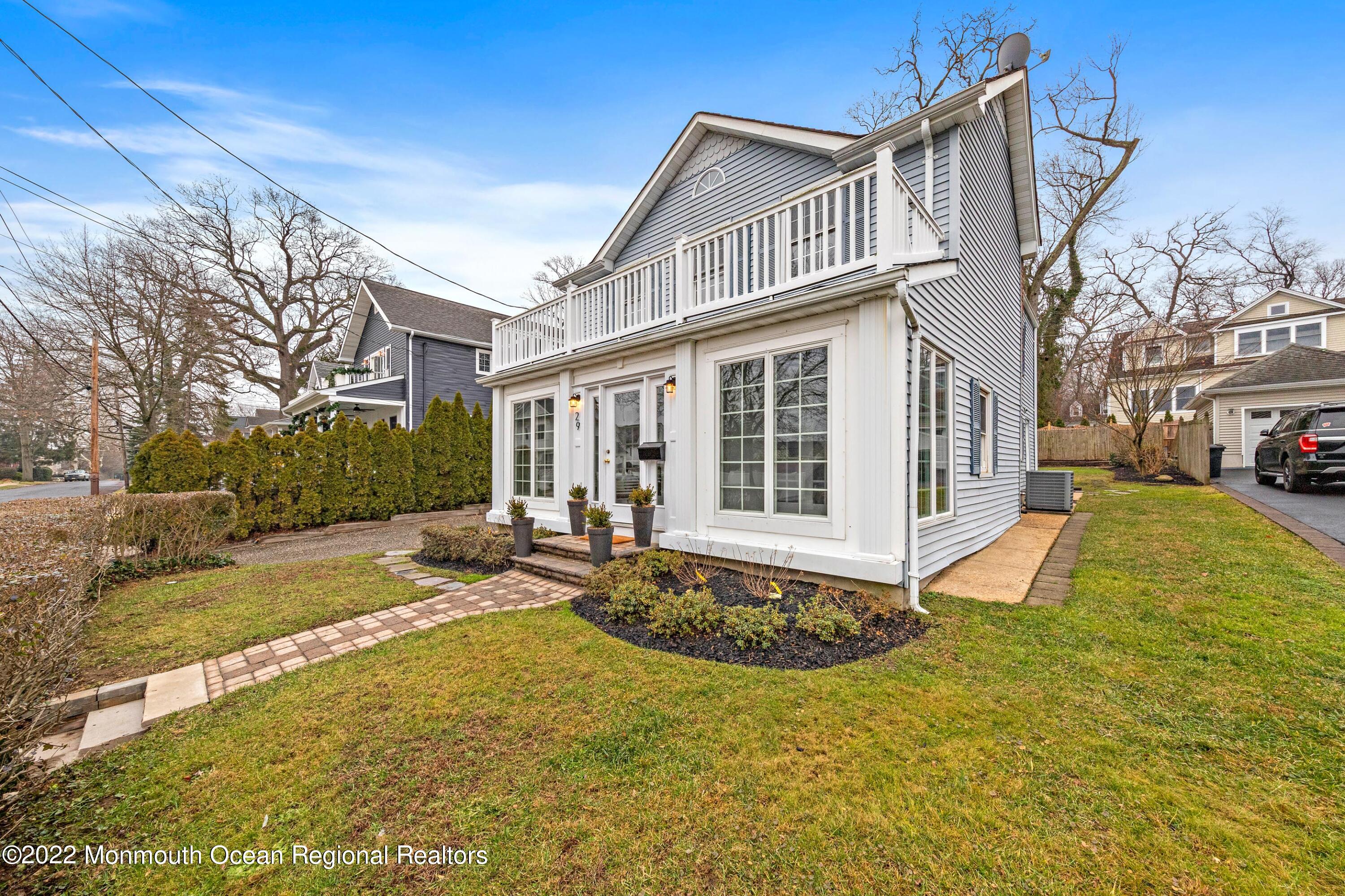 29 Church Street Rumson, NJ 07760 - Photo 1 of 42 a view of a house with backyard and sitting area