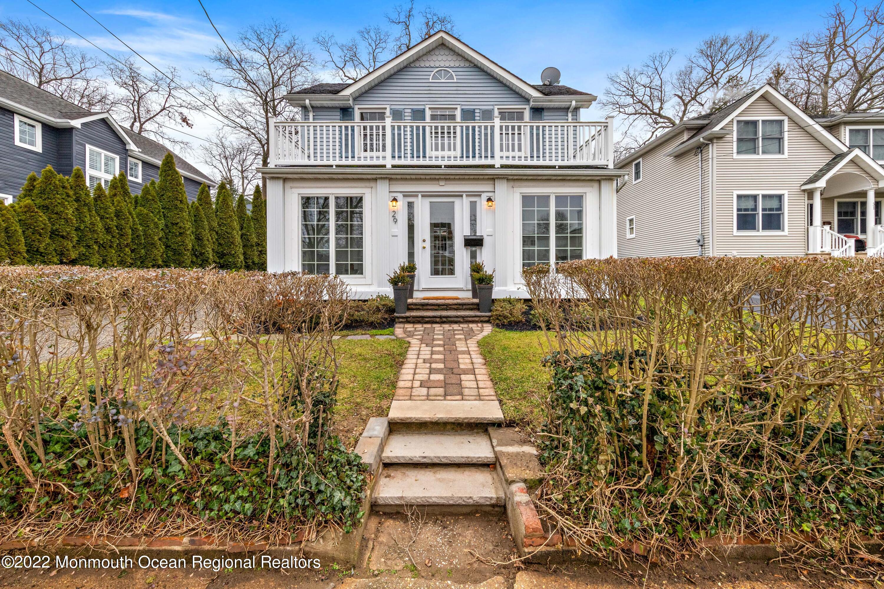 29 Church Street Rumson, NJ 07760 - Photo 2 of 42 front view of a house with a yard