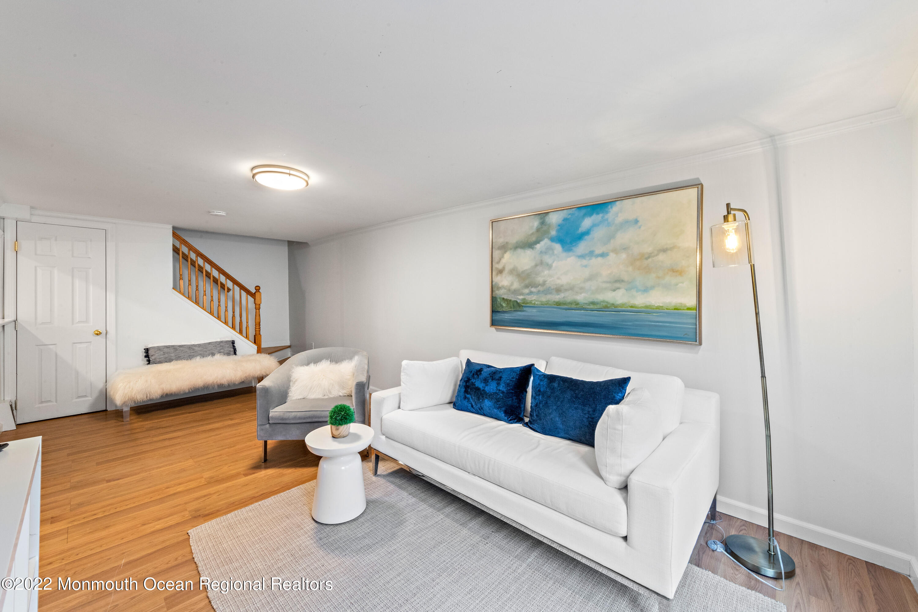 29 Church Street Rumson, NJ 07760 - Photo 24 of 42 a living room with furniture and a wooden floor